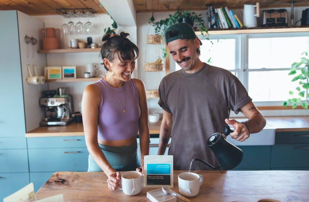 A man and woman standing in front of a kitchen counter | Eamon & Bec