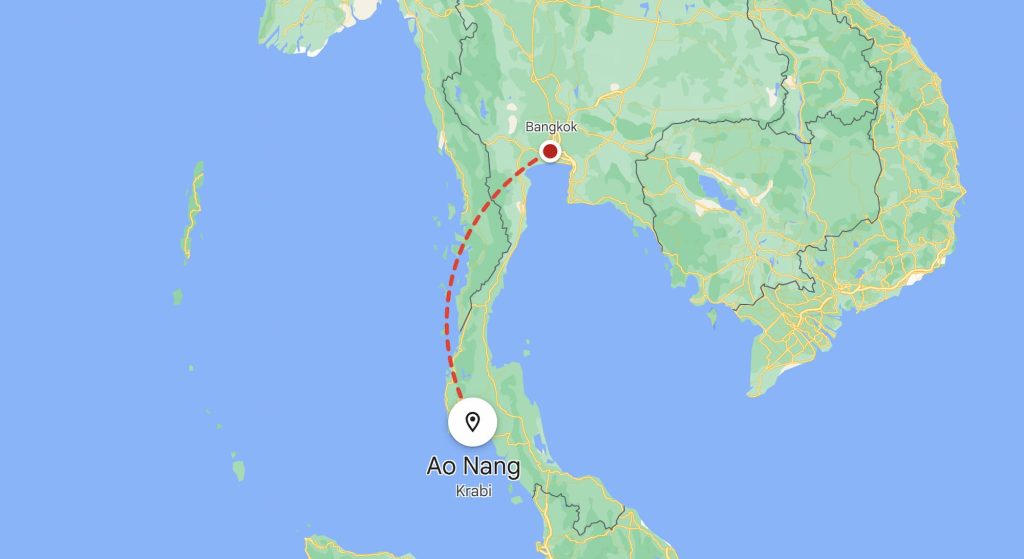 Map showing a route from Bangkok, Thailand to Ao Nang in Krabi. A dashed red line indicates the travel path between the two locations.